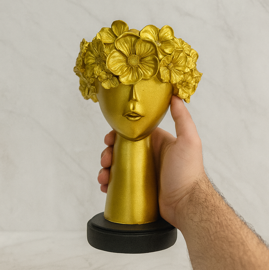 Abstract golden face sculpture