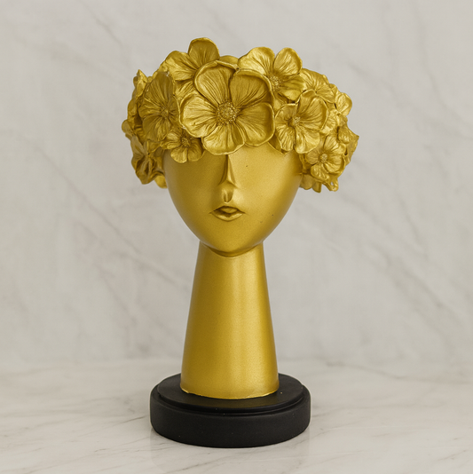 Abstract golden face sculpture